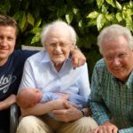 Four Generations of Men on Father's Day holding a baby.