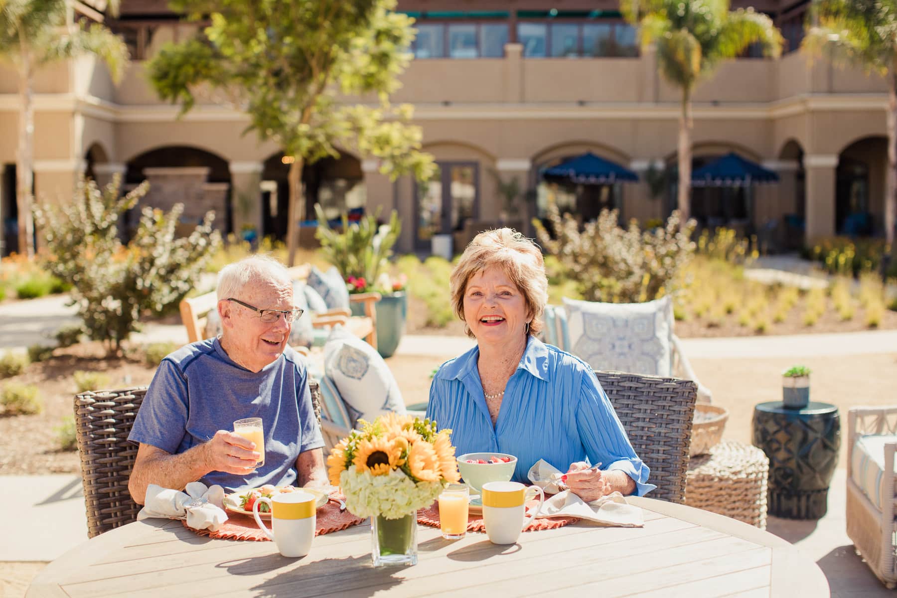 elderly couple enjoying breakfast