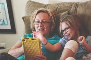 Woman and Girl Using Tablet