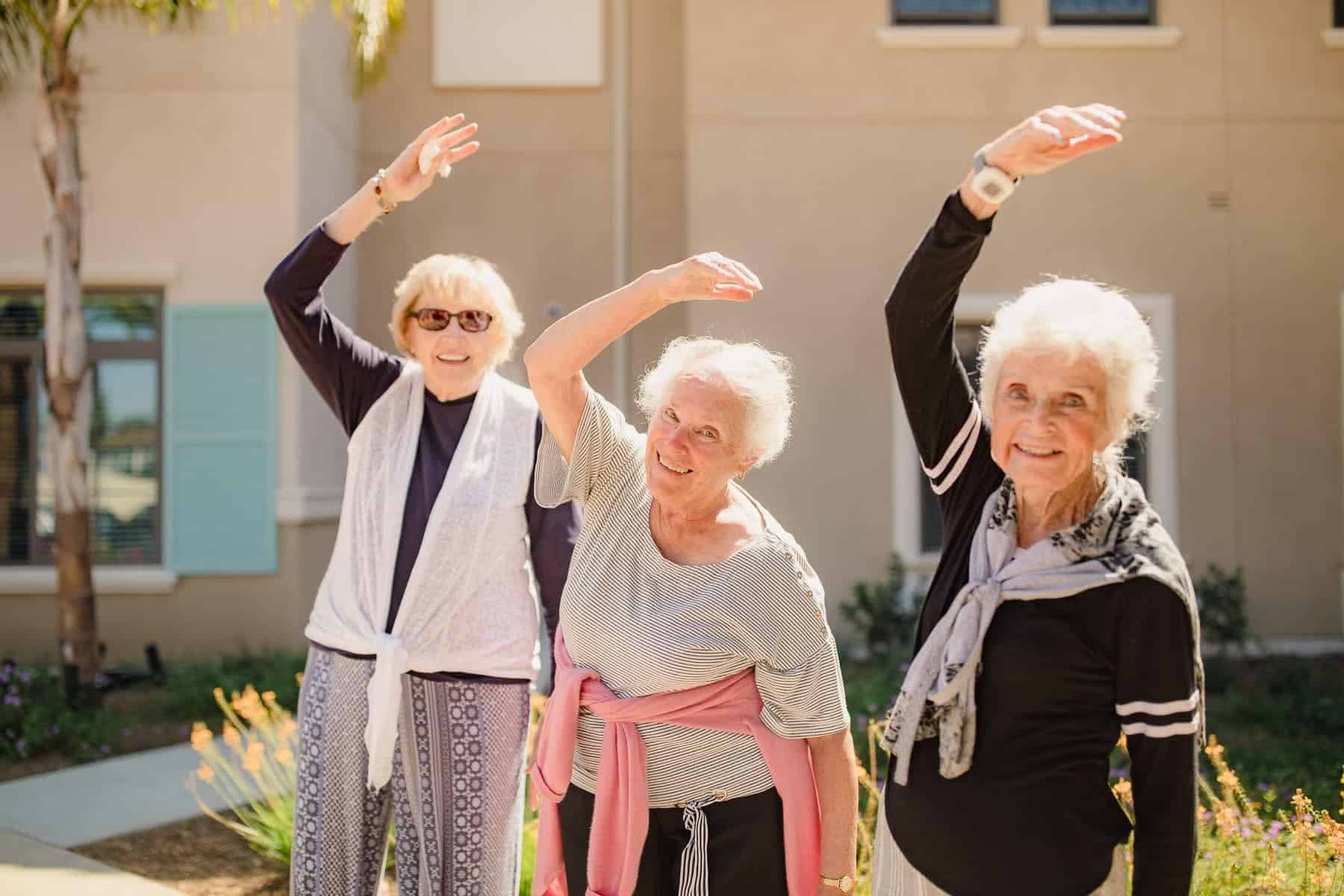 senior women exercising outside