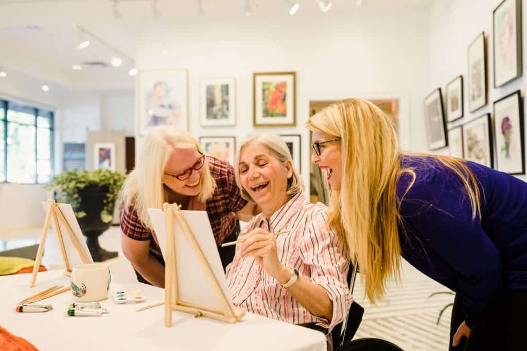 art gallery elderly mother and daughters