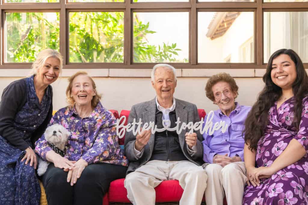 resident and team members holding 