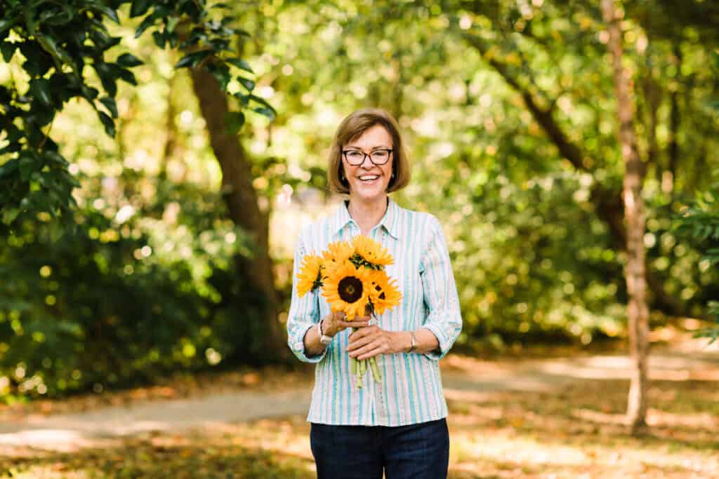 woman holding sunflowers