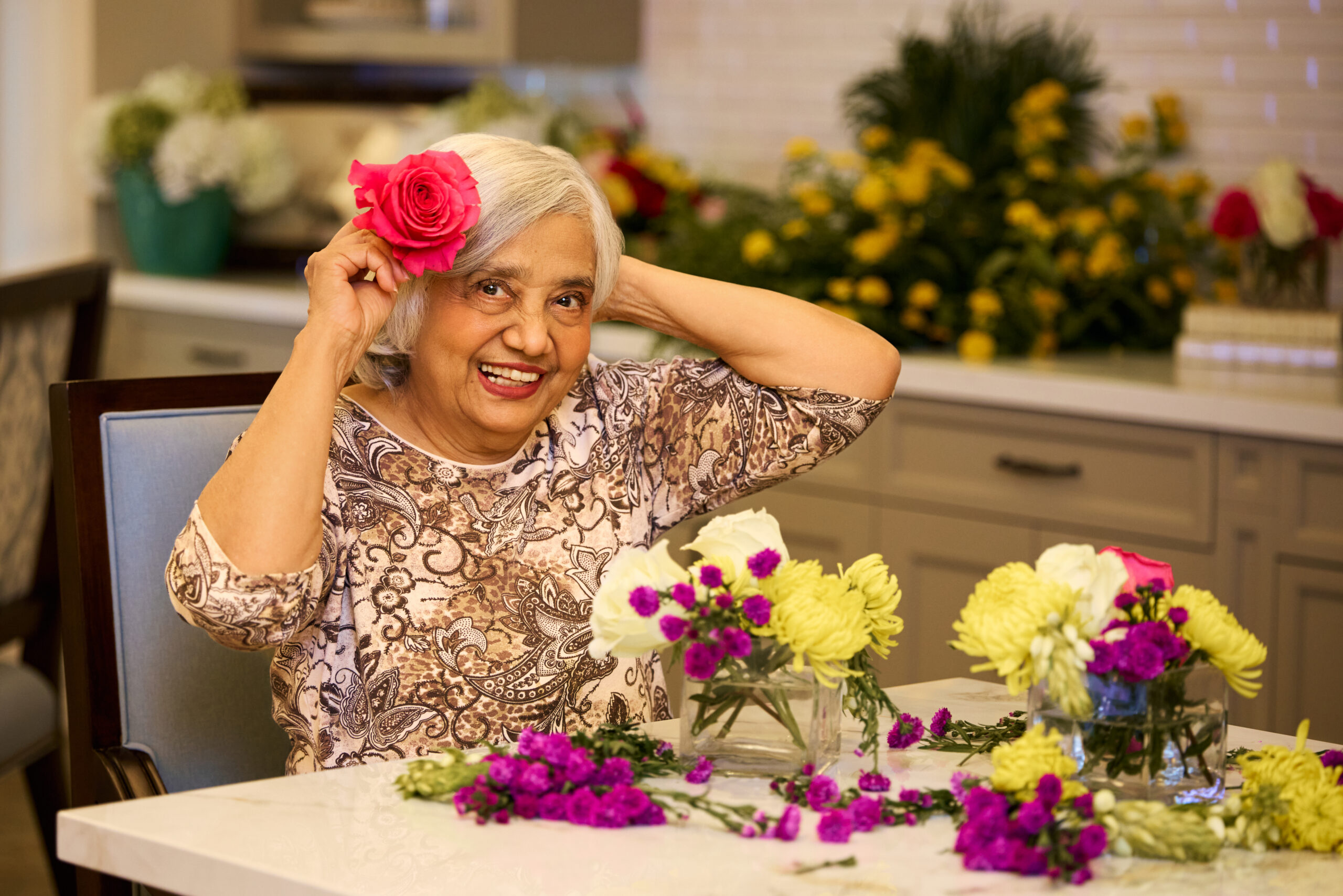 senior lady working on flower arrangements